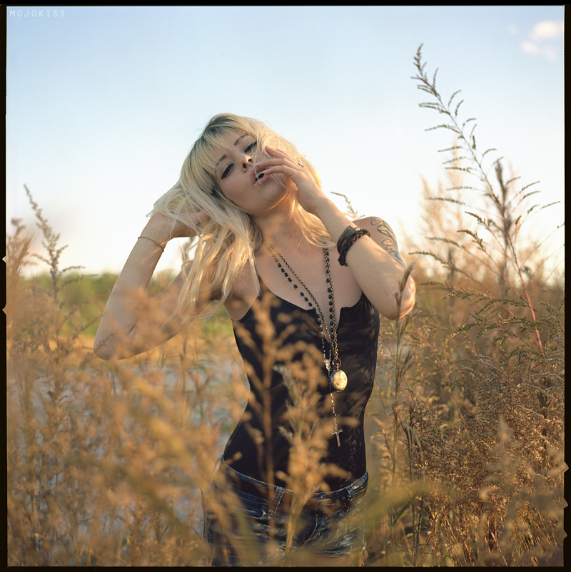 mojokiss photo using a hasselblad camera with square frame and kodak ektar film with natural light on mandy murphy in orlando, fl.