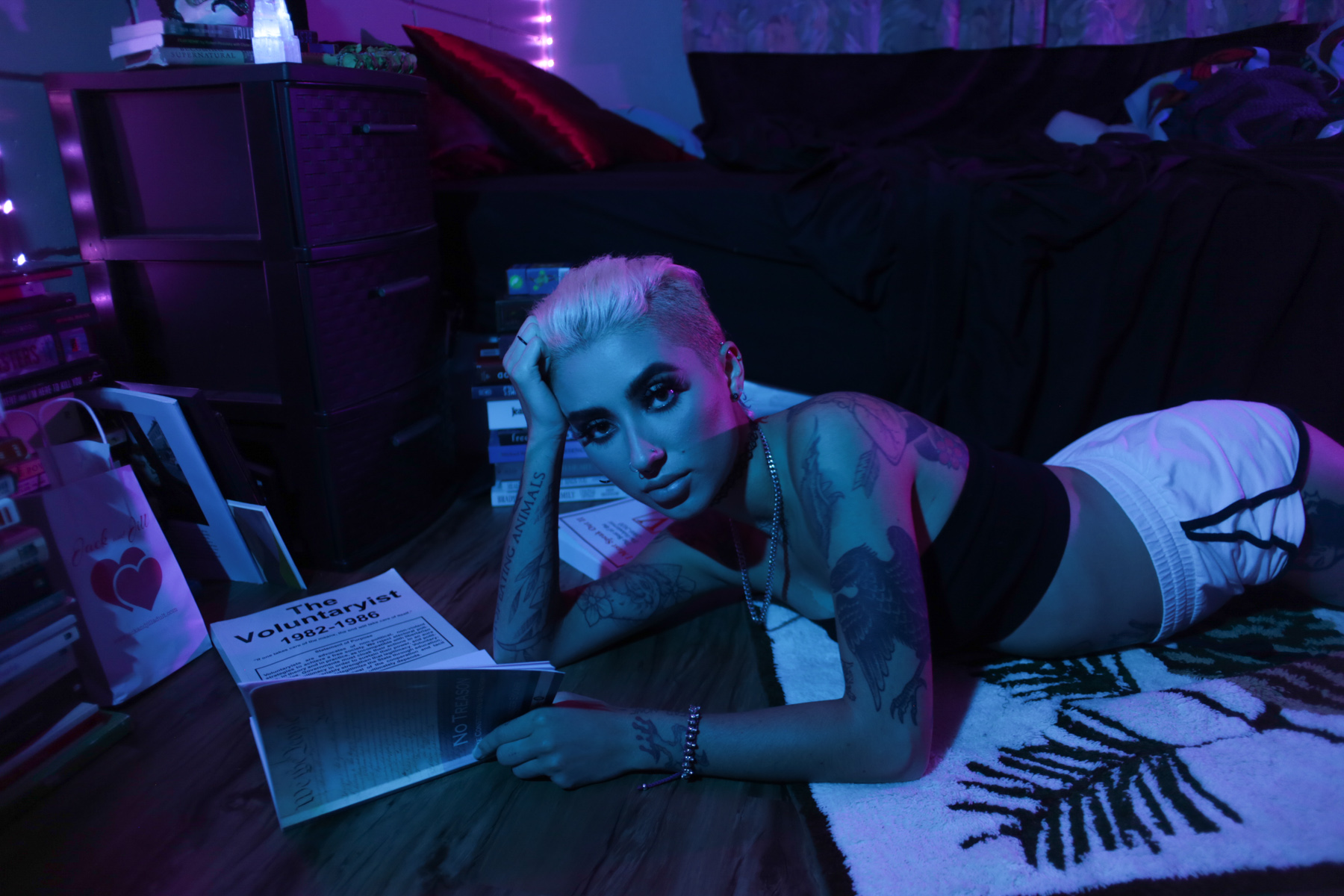 model in motel with blue light